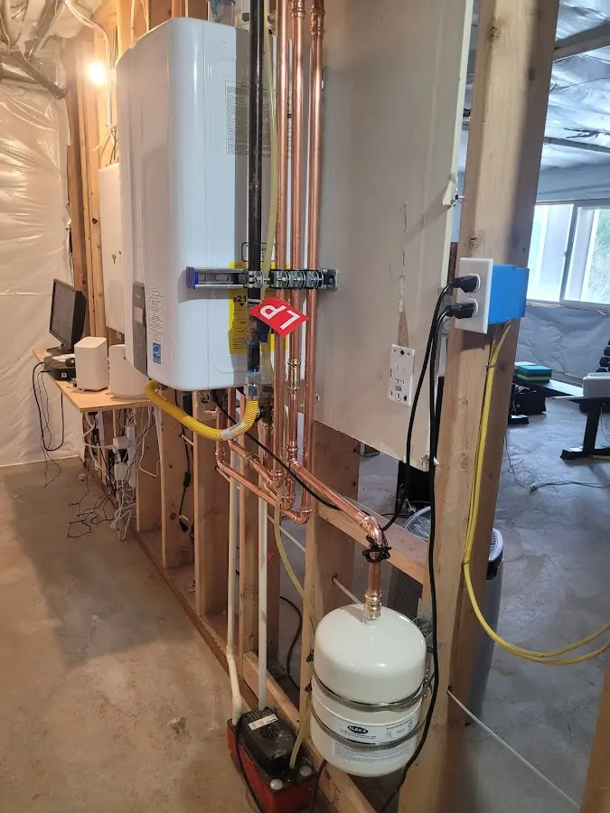 Licensed plumber repairing a kitchen sink in Mamakating